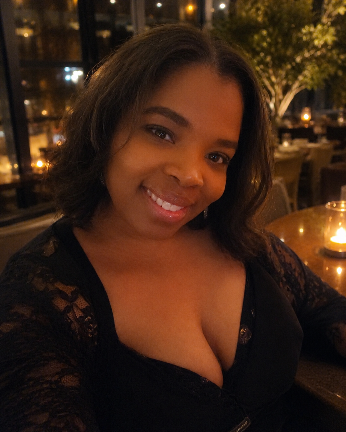 Tiffany Palmer smiling in a warm headshot