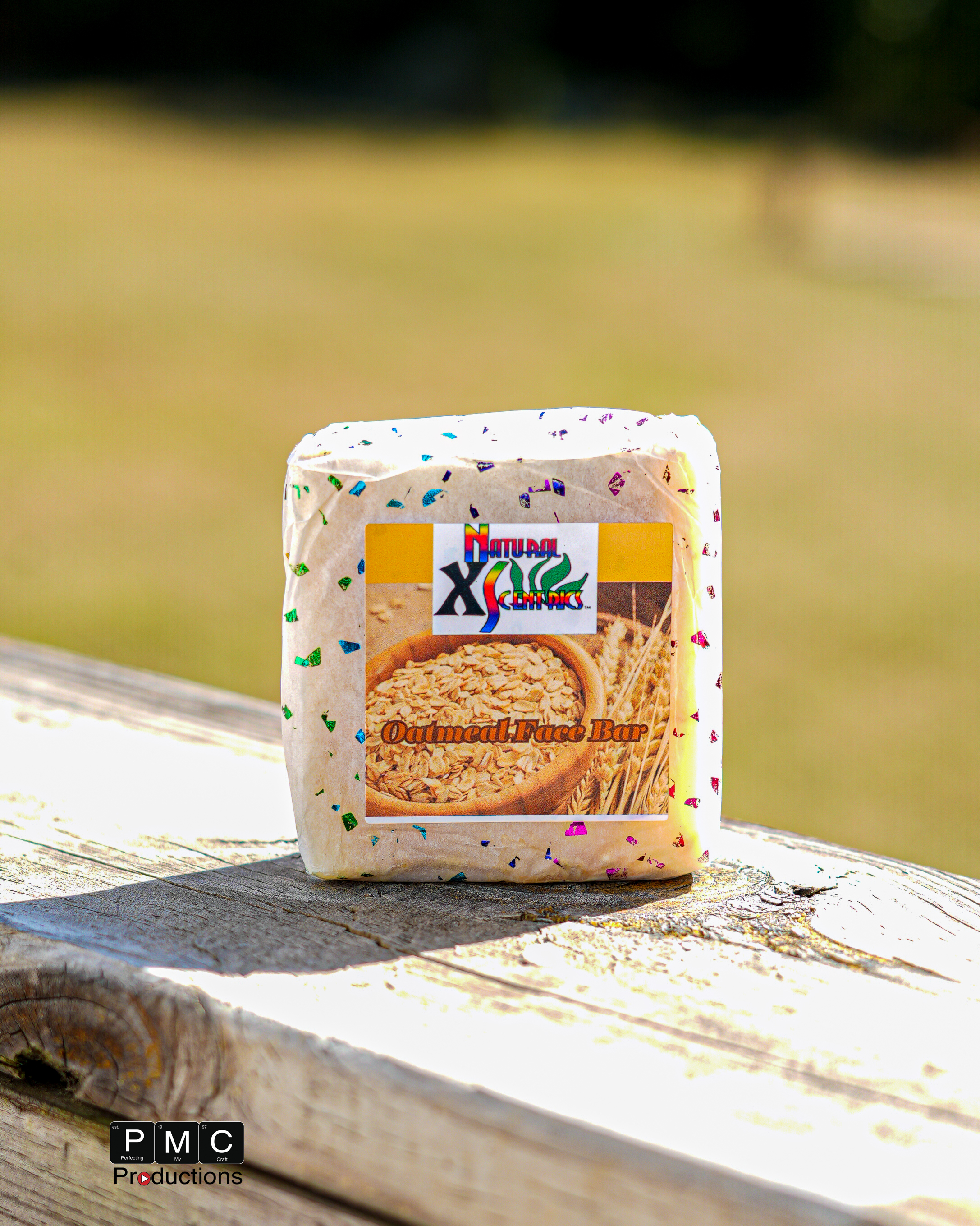 Oatmeal soap bar in branded wrapping displayed outdoors